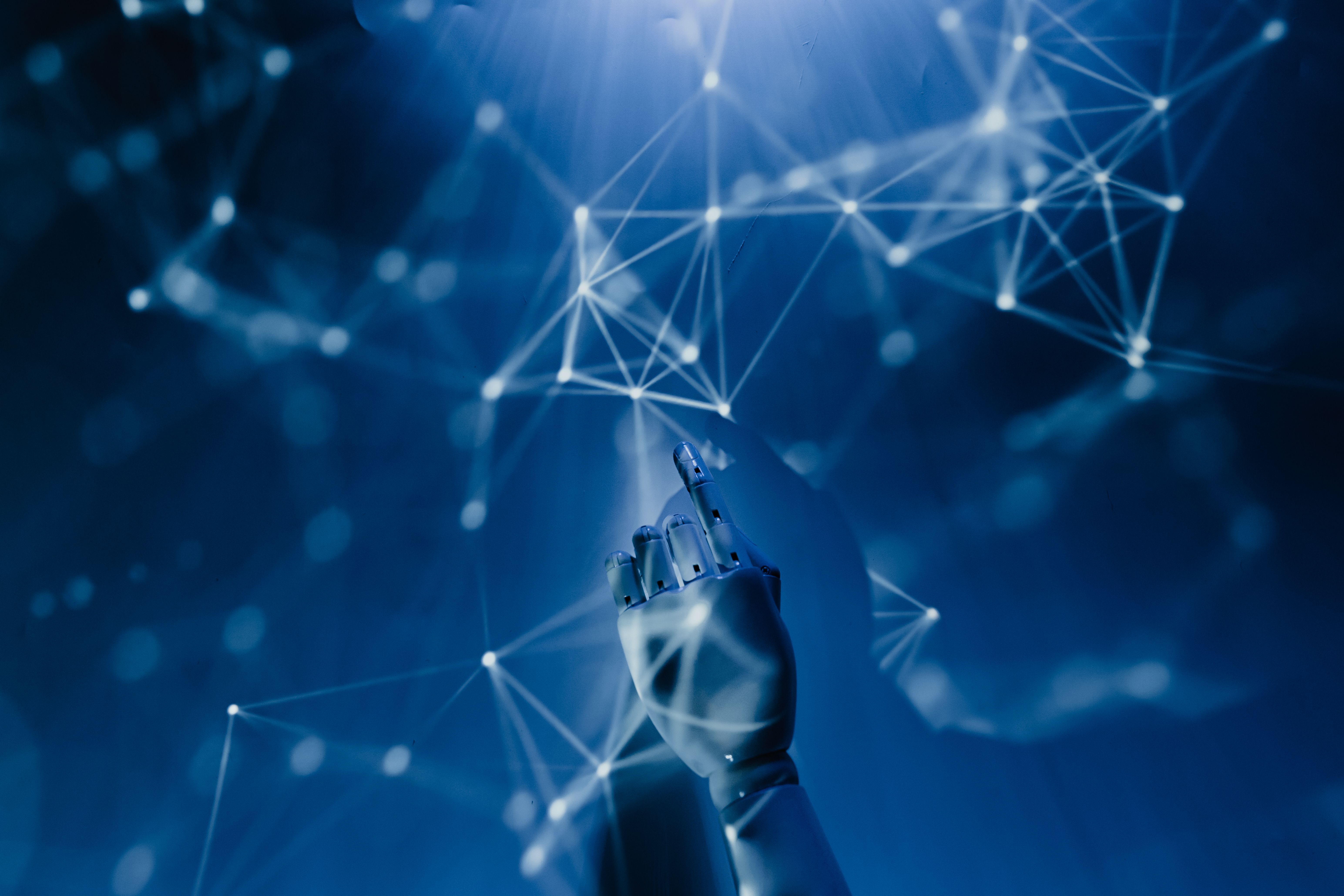 Robotic hand reaching into a digital network, symbolizing artificial intelligence and automated content analysis.